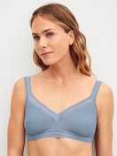 Women model is wearing Soft bra made of Modal in Blue, Lace from the Etude Ajours series by CALIDA, Front view