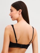 Women model is wearing Soft bra made of Modal in Black, Unicoloured from the Etude Ajours series by CALIDA, Back view