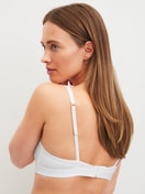 Women model is wearing Soft bra made of Polyamide in White, Unicoloured from the Sleek Skin series by CALIDA, Back view
