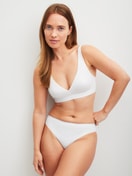 Women model is wearing Soft bra made of Polyamide in White, Unicoloured from the Sleek Skin series by CALIDA, Outfit