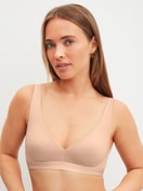 Women model is wearing Soft bra made of Polyamide in Beige, Unicoloured from the Sleek Skin series by CALIDA, Front view