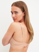 Women model is wearing Soft bra made of Polyamide in Beige, Unicoloured from the Sleek Skin series by CALIDA, Back view