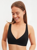 Women model is wearing Soft bra made of Polyamide in Black, Unicoloured from the Sleek Skin series by CALIDA, Front view