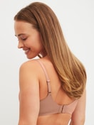 Women model is wearing Bonded Bra made of Modal in Grey, Unicoloured from the Natural Skin series by CALIDA, Back view
