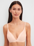Women model is wearing Soft bra without underwire made of Cotton in Pink, Unicoloured from the Cate series by CALIDA, Front view