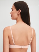 Women model is wearing Soft bra without underwire made of Cotton in Pink, Unicoloured from the Cate series by CALIDA, Back view