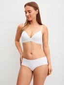 Women model is wearing Padded bra without underwire made of Polyamide in White, Unicoloured from the Sleek Skin series by CALIDA, Outfit