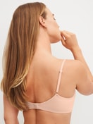 Women model is wearing Padded bra without underwire made of Polyamide in Beige, Unicoloured from the Sleek Skin series by CALIDA, Back view