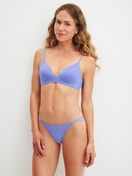 Women model is wearing Padded bra without underwire made of Polyamide in Blue, Unicoloured from the Sleek Skin series by CALIDA, Outfit