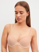 Women model is wearing Moulded Bra with Multiway Straps made of Polyamide in Beige, Unicoloured from the Sleek Skin series by CALIDA, Front view