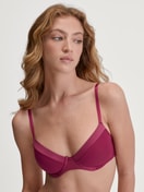 Underwired T-shirt bra Women model is wearing Underwired T-shirt bra made of 100% Cotton in Pink, Unicoloured from the Cate series by CALIDA, Front view