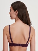 Women model is wearing Spacer bra with wires made of Polyamide in Red, Lace from the Sensual Secrets series by CALIDA, Back view