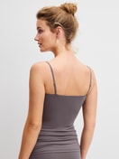 Women model is wearing Spaghetti top made of Polyamide in Brown, Unicoloured from the Sleek Skin series by CALIDA, Back view