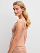 Women model is wearing Spaghetti top made of Cotton in Beige, Unicoloured from the Cate series by CALIDA, Back view