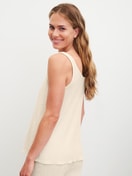 Women model is wearing Tank top made of Cotton in Beige, Unicoloured from the Favourites Layering series by CALIDA, Back view