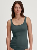 Women model is wearing Tank top made of Cotton in Green, Unicoloured from the Natural Comfort series by CALIDA, Front view