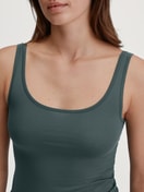 Women model is wearing Tank top made of Cotton in Green, Unicoloured from the Natural Comfort series by CALIDA, Detail