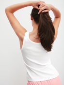 Women model is wearing Tank top made of Cotton in White, Unicoloured from the Favourites Beach series by CALIDA, Back view