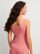 Women model is wearing Tank top made of Cotton in Pink, Unicoloured from the Etude Xtra series by CALIDA, Back view