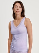 Women model is wearing Tank top made of Cotton in Purple, Lace from the Natural Comfort Lace series by CALIDA, Front view