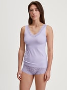 Women model is wearing Tank top made of Cotton in Purple, Lace from the Natural Comfort Lace series by CALIDA, Outfit