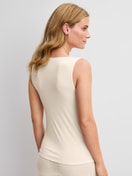 Women model is wearing Wool-Silk Tank Top made of Wool in Beige, Unicoloured from the True Confidence series by CALIDA, Back view