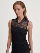 Women model is wearing Tank top made from wool and silk made of Lace in Black, Lace from the Silky Wool Glam series by CALIDA, Front view