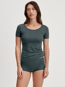 Women model is wearing Shirt shortsleeve made of Cotton in Green, Unicoloured from the Natural Comfort series by CALIDA, Outfit