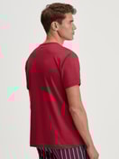 Men model is wearing Short-sleeved shirt made of 100% Cotton in Red, Unicoloured from the Remix Basic Sleep series by CALIDA, Front view