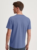 Men model is wearing Short-sleeved shirt made of 100% Cotton in Blue, Unicoloured from the Remix Basic Sleep series by CALIDA, Back view