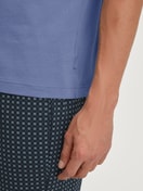 Men model is wearing Short-sleeved shirt made of 100% Cotton in Blue, Unicoloured from the Remix Basic Sleep series by CALIDA, Detail