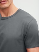 Men model is wearing Short-sleeved shirt made of 100% Cotton in Grey, Unicoloured from the RMX Sleep Leisure series by CALIDA, Detail