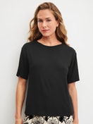 Women model is wearing Shirt short sleeve made of Modal in Black, Unicoloured from the Favourites Layering series by CALIDA, Front view