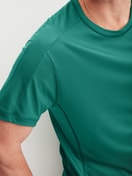 Men model is wearing Shirt short sleeve made of Lyocell in Green, Unicoloured from the DSW Cooling series by CALIDA, Detail