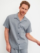 Men model is wearing Short shirt with button facing made of 100% Cotton in Grey, Unicoloured from the RMX Sleep Journey series by CALIDA, Front view