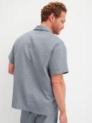 Men model is wearing Short shirt with button facing made of 100% Cotton in Grey, Unicoloured from the RMX Sleep Journey series by CALIDA, Back view