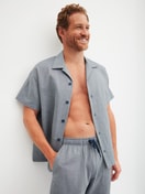 Men model is wearing Short shirt with button facing made of 100% Cotton in Grey, Unicoloured from the RMX Sleep Journey series by CALIDA, Front view
