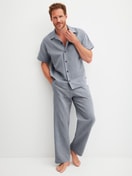 Men model is wearing Short shirt with button facing made of 100% Cotton in Grey, Unicoloured from the RMX Sleep Journey series by CALIDA, Outfit