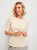 Women model is wearing Shirt short sleeve made of Cotton in Beige, Unicoloured from the Favourites Arts series by CALIDA, Front view