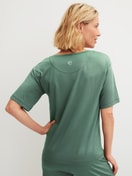 Women model is wearing Shirt short sleeve made of Modal in Green, Unicoloured from the DSW Balancing series by CALIDA, Back view