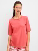 Le mannequin Femme porte le/la T-shirt à manches courtes en 100% coton de couleur Orange, Unicolore, de la série Favourites Beach de CALIDA, Vue de face