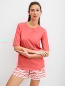 Le mannequin Femme porte le/la T-shirt à manches courtes en 100% coton de couleur Orange, Unicolore, de la série Favourites Beach de CALIDA, Tenue