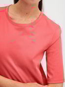 Le mannequin Femme porte le/la T-shirt à manches courtes en 100% coton de couleur Orange, Unicolore, de la série Favourites Beach de CALIDA, Détail