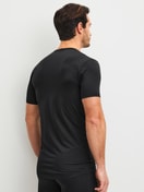 La modella / Il modello Uomo indossa  in Poliammide di colore Nero, Tinta unita, della serie Micro Stretch di CALIDA, Vista posteriore