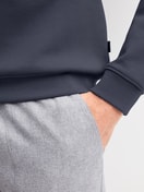 Men model is wearing Sweatshirt made of Cotton in Grey, Unicoloured from the RMX Lounge Casual series by CALIDA, Detail