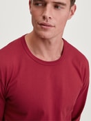 Men model is wearing Shirt long sleeve made of 100% Cotton in Red, Unicoloured from the Remix Basic Sleep series by CALIDA, Front view
