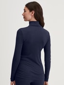 Women model is wearing Long-sleeve turtleneck shirt in wool-silk made of Wool in Blue, Unicoloured from the True Confidence series by CALIDA, Back view