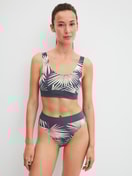 Women model is wearing Brief, high waist made of Cotton in Grey, Floral from the Elastic Trend series by CALIDA, Outfit