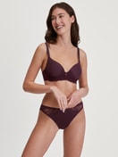 Women model is wearing Brief, regular cut made of Lace in Red, Lace from the Sensual Secrets series by CALIDA, Outfit