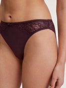 Women model is wearing Brief, regular cut made of Lace in Red, Lace from the Sensual Secrets series by CALIDA, Detail